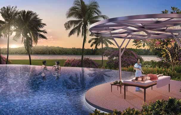 Serene poolside scene at Riversound Residence during sunset, with two residents enjoying the water and another receiving a massage under a modern canopy. Surrounded by palm trees, flowering shrubs, and a peaceful riverside backdrop, the setting evokes a resort-style atmosphere focused on relaxation and wellness.