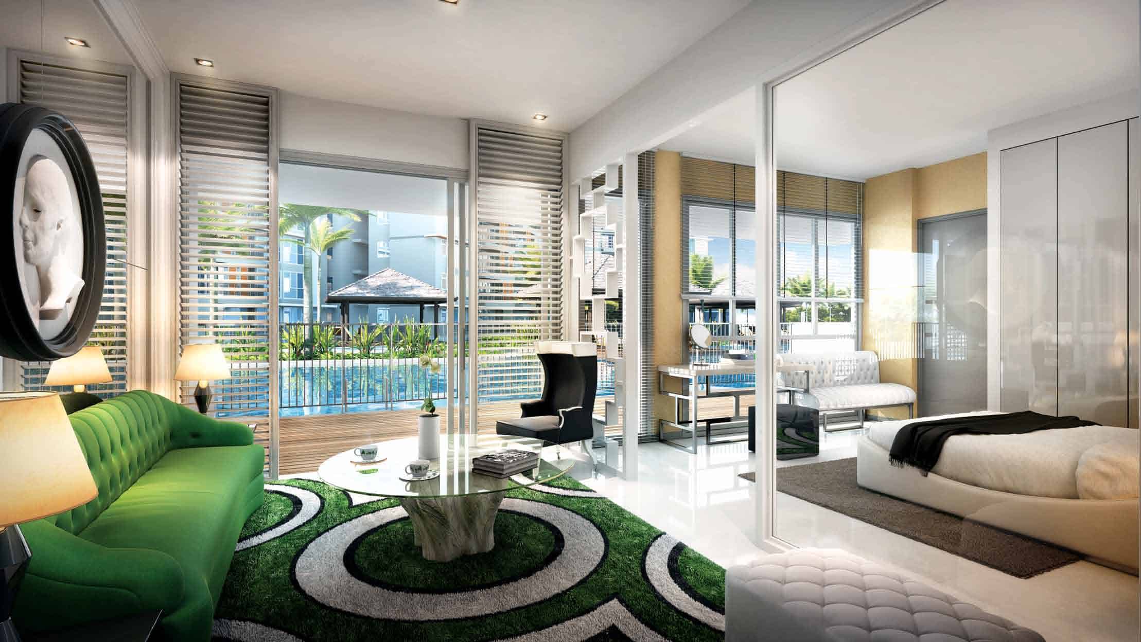 Interior view of a stylishly furnished unit at Qbay Residences, featuring a modern open-plan living room and bedroom with full-height glass doors leading to a private balcony that overlooks the pool and tropical landscaping outside.